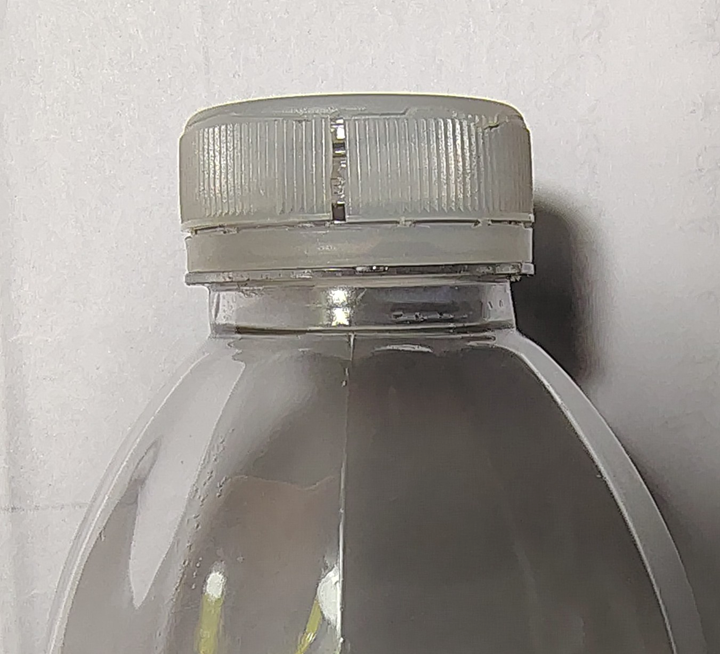 Cracked bottle cap on a bottle