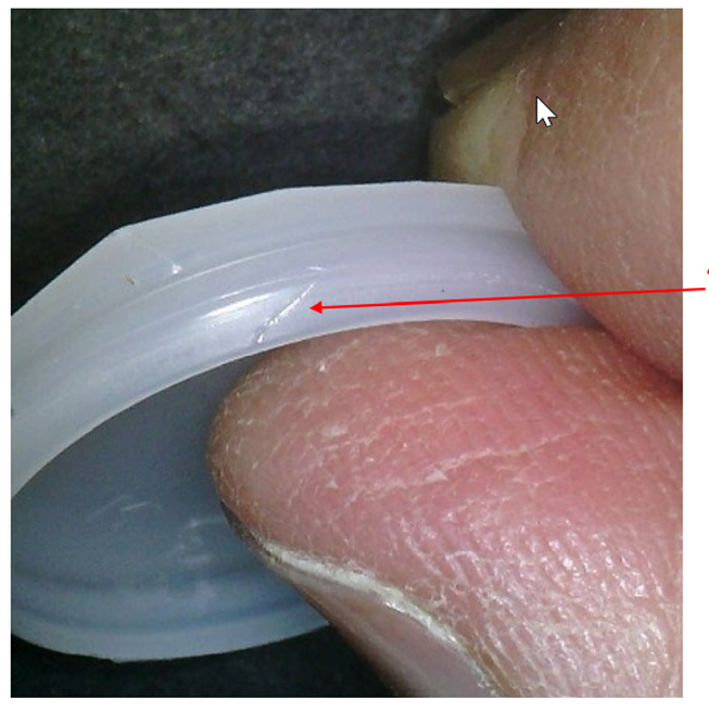 Deformed top of a soft bottle